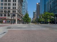 an intersection with buildings on both sides and a street light in the middle of the road