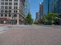 an intersection with buildings on both sides and a street light in the middle of the road