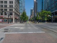 an intersection with buildings on both sides and a street light in the middle of the road