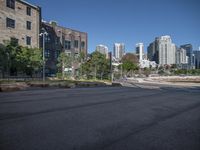 view of a downtown area with high rises and buildings on the other side of the street