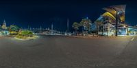 a view at night showing a city and its traffic lights out into the distance and buildings