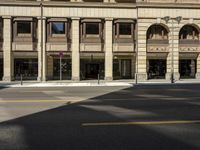 a picture of an old looking building next to the street with traffic signal on it