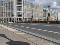 the empty street has signs on it in front of some buildings in a european city