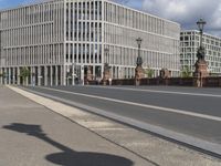 the empty street has signs on it in front of some buildings in a european city