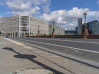 the empty street has signs on it in front of some buildings in a european city