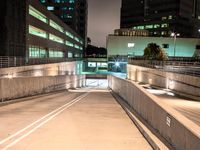 an empty parking garage with no people at night, in the middle of a city