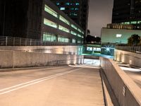 an empty parking garage with no people at night, in the middle of a city