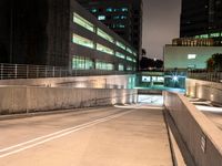 an empty parking garage with no people at night, in the middle of a city