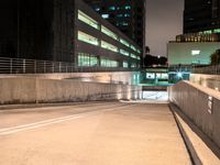 an empty parking garage with no people at night, in the middle of a city