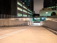 an empty parking garage with no people at night, in the middle of a city