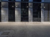 City at Night: Lights Reflecting on Glass Buildings