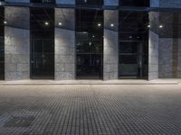 City at Night: Lights Reflecting on Glass Buildings