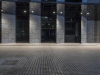 City at Night: Lights Reflecting on Glass Buildings