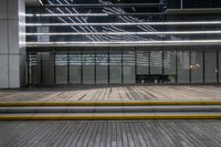 this is a photograph of a empty wooden platform in an empty room outside a building