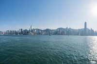there is a city that is on the water and on the shore and in front of the city