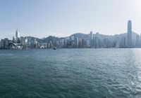 there is a city that is on the water and on the shore and in front of the city