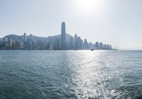 there is a city that is on the water and on the shore and in front of the city
