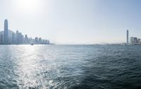 there is a city that is on the water and on the shore and in front of the city