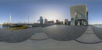 a fish eye lens image of the city skyline and its waterfront in a city park