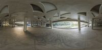 the view of a circular room with ceiling in the center of it, and a walkway on one side