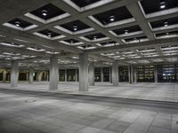 there is an empty building in a large room with some floors and lighting on it