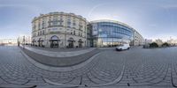 this is a fish eye view of an old building in the city with a very circular mirror effect