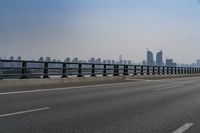 the highway is on its side with the skyline visible in the background as an airplane flies over the highway