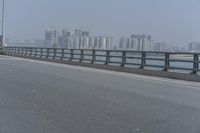 the highway is on its side with the skyline visible in the background as an airplane flies over the highway