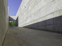 a long street has an interesting concrete structure on it's side as seen from the ground