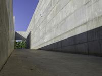 a long street has an interesting concrete structure on it's side as seen from the ground