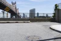 an image of a city from the curb as seen in a magazine advertisement of a sewer cover on a street