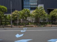 empty road with white lines on the streets of city area against cloudy blue sky on a sunny day