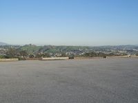 City Road in Residential Area with Mountains - Day 001