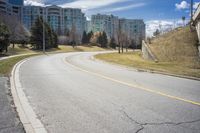 City Road Through Residential Area with Trees