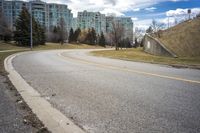 City Road Through Residential Area with Trees