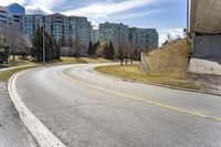 City Road Through Residential Area with Trees