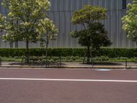 empty road with white lines on the streets of city area against cloudy blue sky on a sunny day