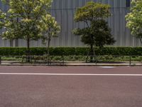 empty road with white lines on the streets of city area against cloudy blue sky on a sunny day