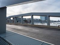 the view of a long highway through a metal grate grid on a city street