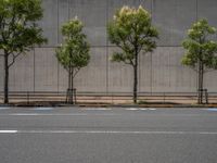 empty road with white lines on the streets of city area against cloudy blue sky on a sunny day