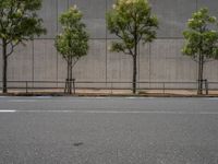 empty road with white lines on the streets of city area against cloudy blue sky on a sunny day