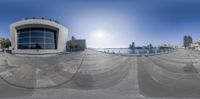 360 view of an outdoor skate park in a city park setting, with circular mirrors