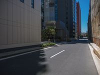 a motorcycle rider riding a bike through a city street in a red suit, red shoes, and sunglasses