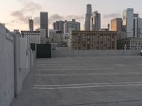 City skyline at dawn with buildings, roads, and infrastructure