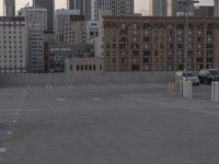 City skyline at dawn with buildings, roads, and infrastructure