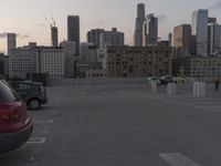 City skyline at dawn with buildings, roads, and infrastructure