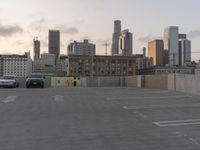 City skyline at dawn with buildings, roads, and infrastructure