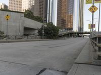 City Skyline at Dawn with Road and Bridge
