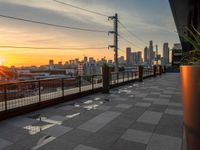 City Skyline at Dawn: Sun Visible on the Horizon