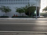 the corner in a street with a fire hydrant near it on it's curb